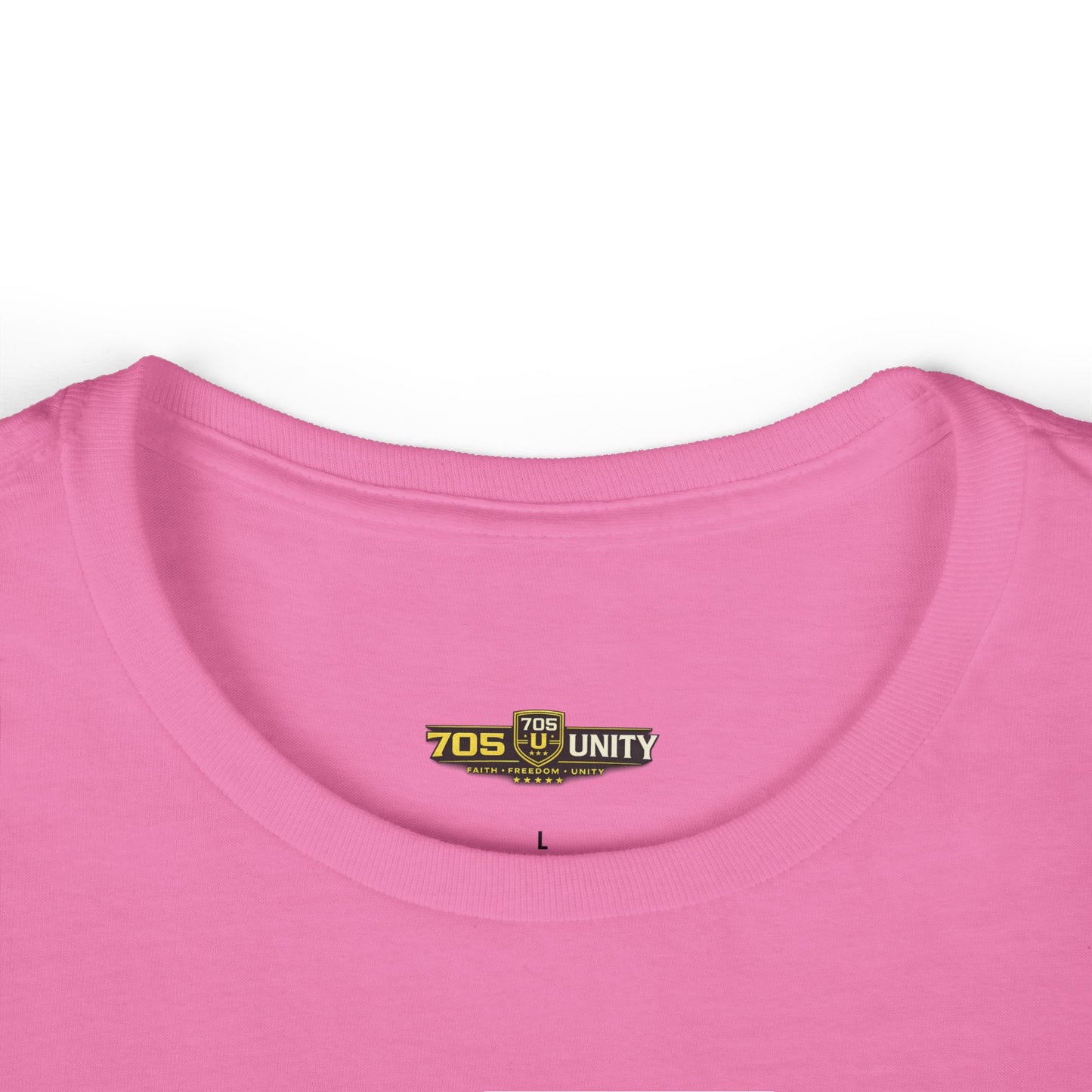 Close-up of a pink shirt with a logo on the collar against a white background